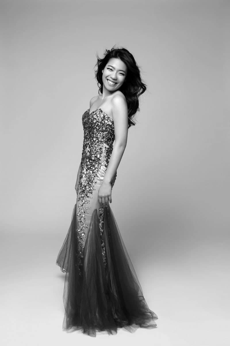 A woman in a dress posing for a picture