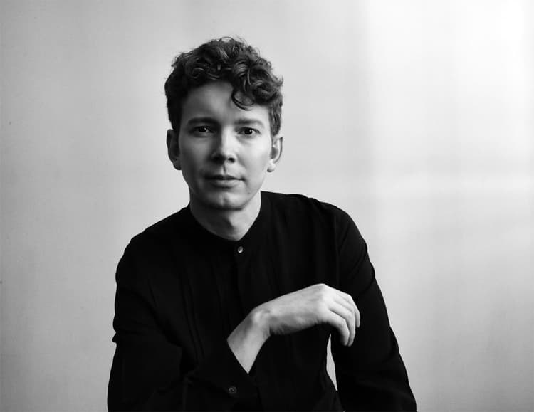 A black and white photo of a young man