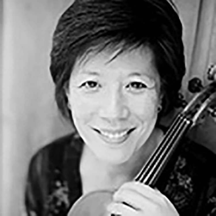 A woman holding a violin in her hands