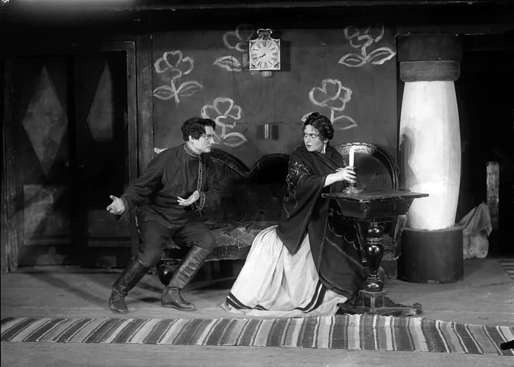 A man and a woman sitting on a bench