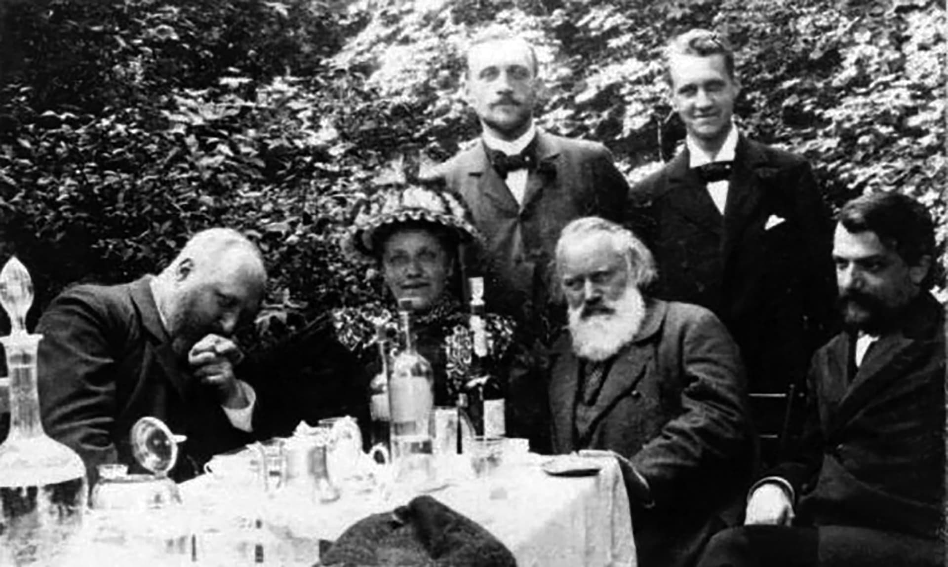 A group of men sitting around a table