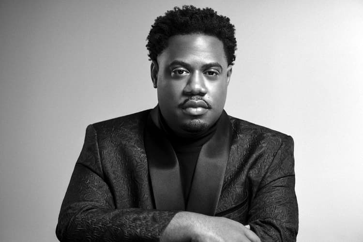 A black and white photo of a man in a suit