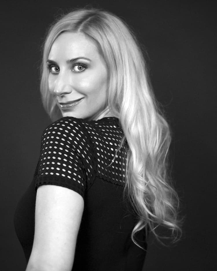 A black and white photo of a woman with long blonde hair