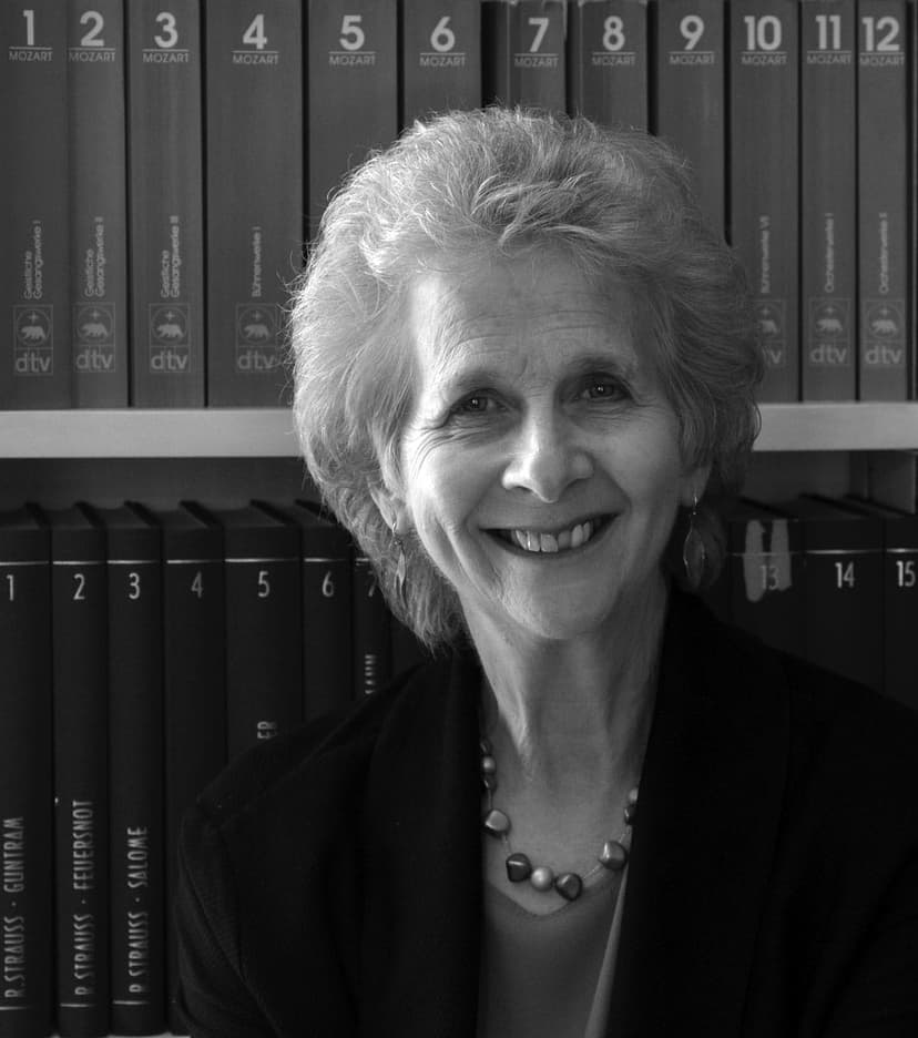 A black and white photo of a woman smiling