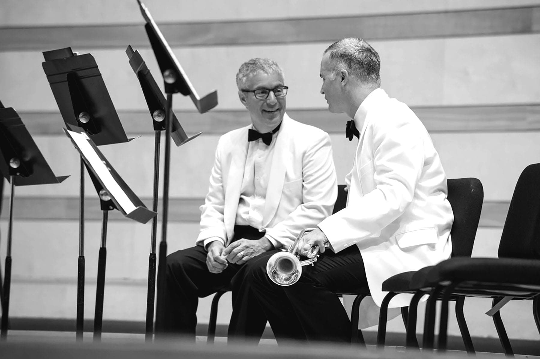 A couple of men sitting next to each other