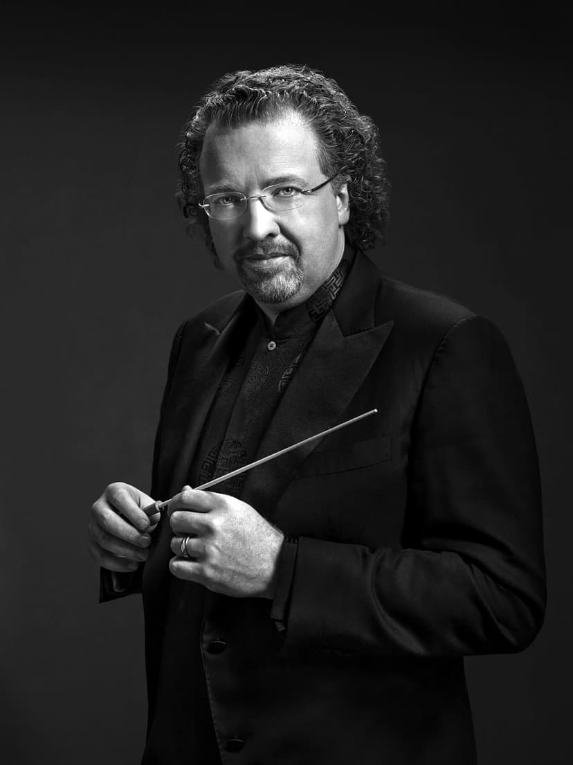 A black and white photo of a man in a suit