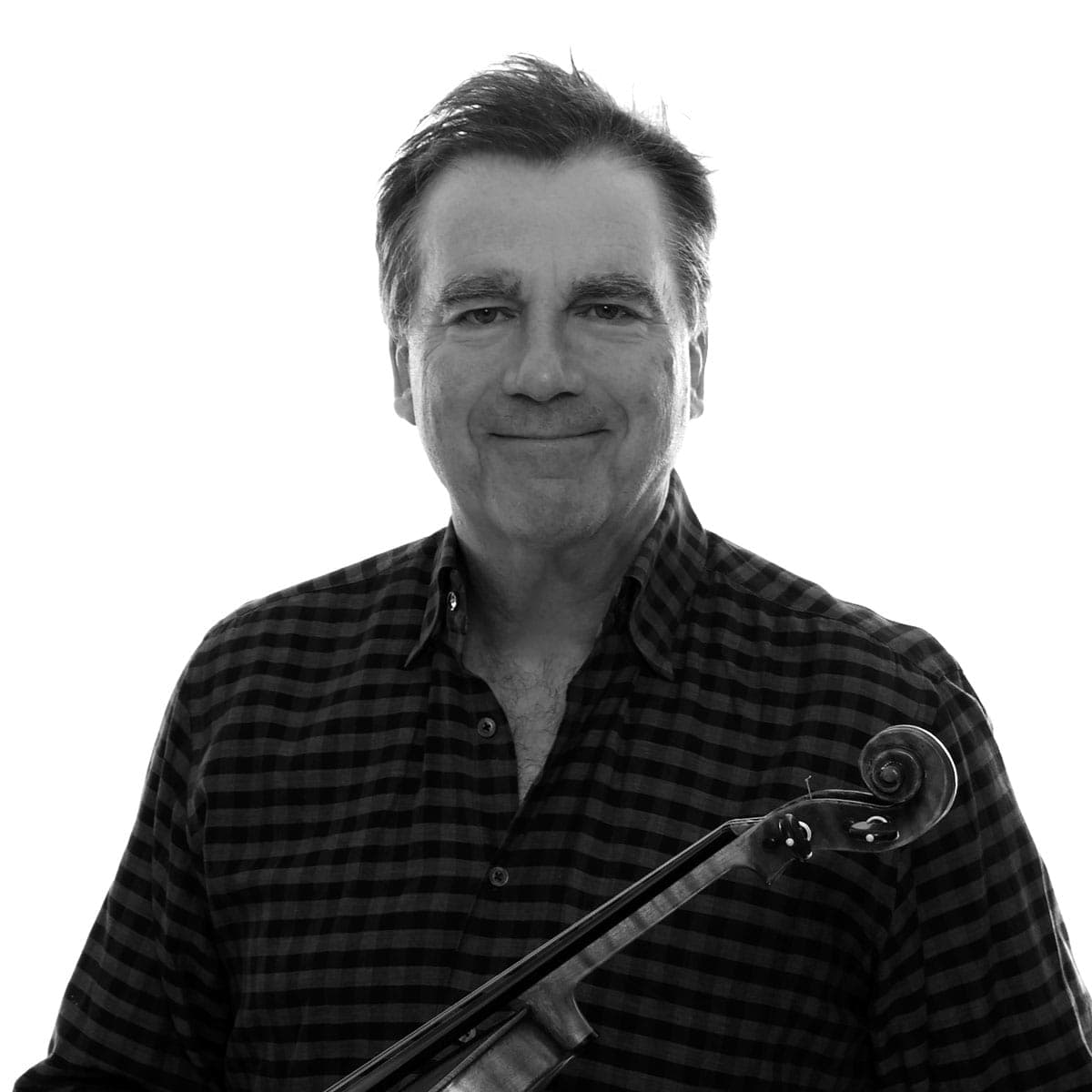 A man holding a violin in his right hand