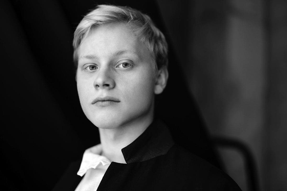 A black and white photo of a young boy