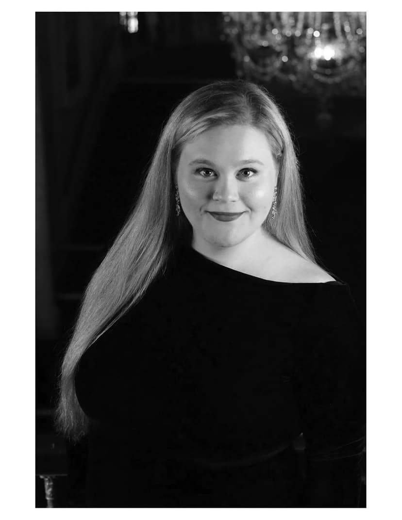 A black and white photo of a woman with long hair