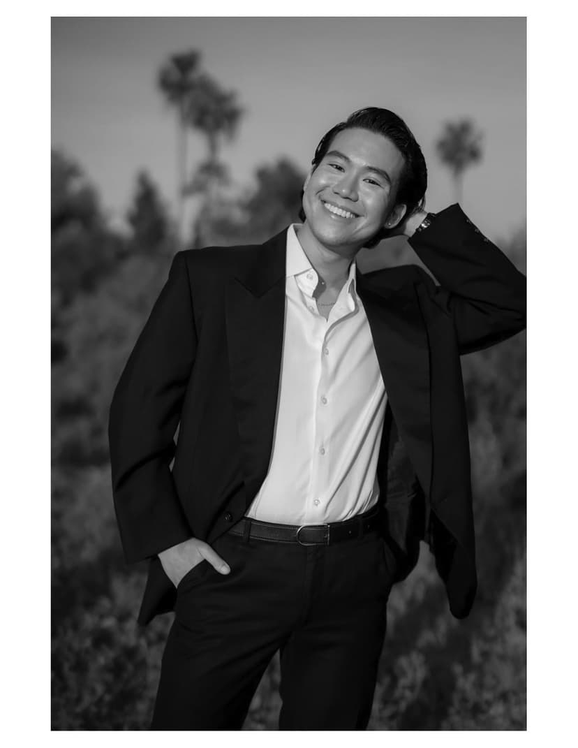 A black and white photo of a man in a suit