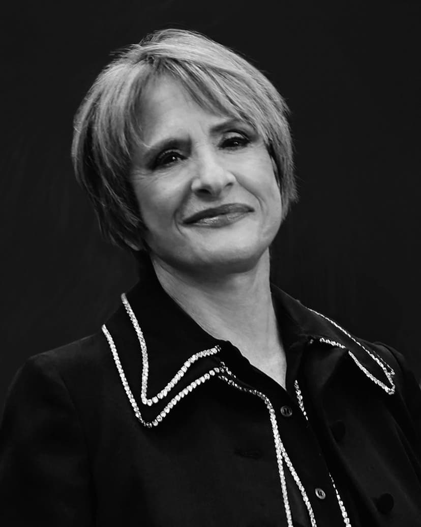 A black and white photo of a woman smiling